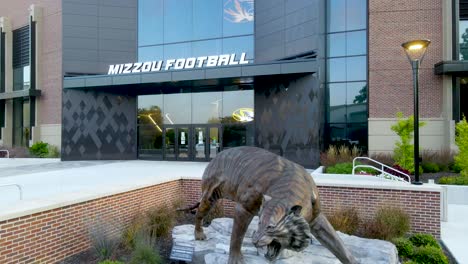 Mizzou-Football-Stadium,-Faurot-Field,---Tiger-Mascot-Statue---Rising-Jib-Aerial-Shot