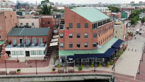 Brown's-Wharf-restaurant-and-bar-at-Fell's-Point,-Inner-Harbor,-Historic-Rukert-Terminals-Corp-ghost-sign-at-Chesapeake-Bay-waterfront