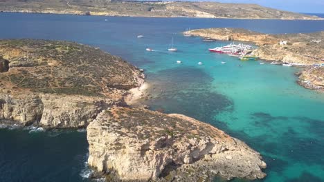 Waves-crash-against-cliffs-as-a-drone-circles-Blue-Lagoon