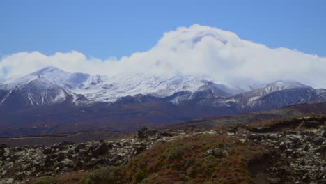 Clouds-roll-over-snowy-peaks-in-the-arthurs-pass-of-New-Zealand