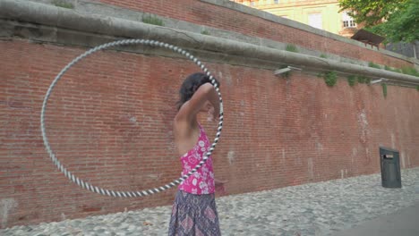 Slow-Motion-Close-up-and-Panning-of-Girl-Doing-Hula-Hoop