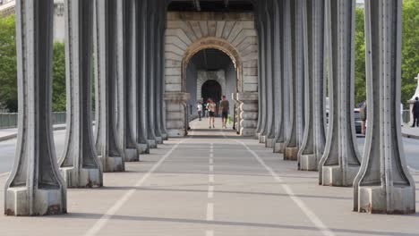 The-Bir-Hakeim-bridge,-formerly-known-as-the-Passy-bridge,-crosses-the-Seine-River-in-Paris-and-is-a-popular-tourist-and-photography-attraction