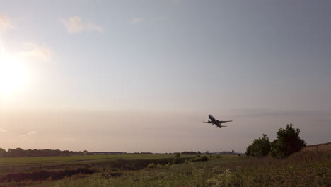 Slow-Motion-Static-Shot-of-Ryanair-Airplane-Departing-from-Leeds-Bradford-International-Airport-in-Yorkshire-on-Beautiful-Summer’s-Morning