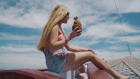 Model-having-a-pinacolada-during-boat-trip-in-Buzios---Rio-De-Janeiro---Brazil