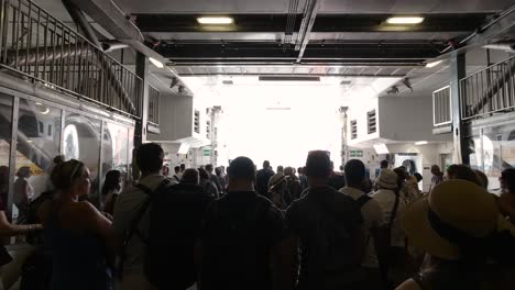 Tourists-waiting-to-disembark-ferry,-interior-view