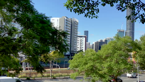 Busy-Brisbane-street-with-city-buildings-and-Roma-St-train-station-in-background-Queensland-Australia