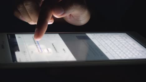 Close-Shot-of-a-Man-Typing-on-a-Tablet