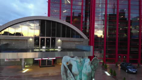 Opera-house-building-in-Krakow-at-dawn,-pedestal-drone-shot