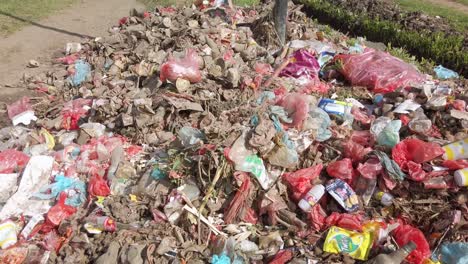 Garbage-on-street-pan-up-reveals-street-view,-Papua-New-Guinea