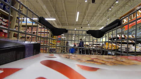 Editorial,-timelapse,-view-of-camera-inside-shopping-cart,-shopping-trolley,-along-the-aisles-of-a-supermarket-while-doing-grocery