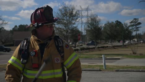 Firefighters-pull-gear-out-of-a-fire-truck-to-respond-to-a-fire