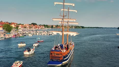 The-cruise-ship-leaves-the-port-accompanied-by-small-boats