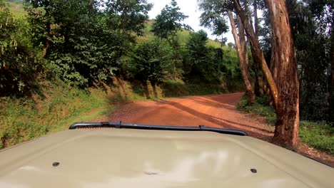 Sped-up-drive-along-mountain-pass-in-Rwan-a-Volcanoes-National-Park-with-steep-narrow-roads