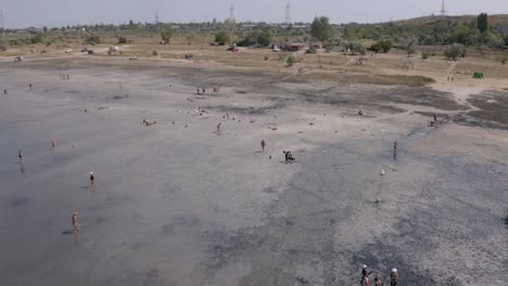 People-bathing-in-black-mud,Kuyalnik-Liman,-Odesa,-Ukraine