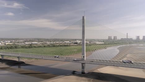 Vehicles-crossing-over-landmark-river-Mersey-gateway-bridge-aerial-view-panning-right