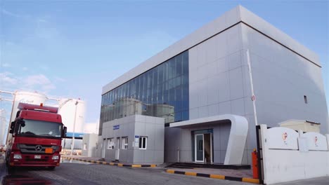 Tank-Truck-Leaving-A-Petroleum-Company-In-Dubai,-UAE-At-Daytime---slow-motion