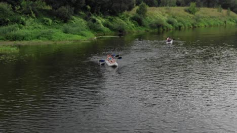 Aerial-drone-tracking-shot-of-two-dinghy-boats-racing-in-a-lake