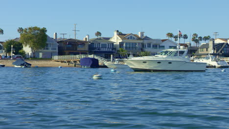 Slow-motion-Sailing-by-Luxury-Boats-and-Oceanfront-Property