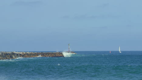 Slow-motion-Waves-Crashing-on-Jetty-in-Pacific-Ocean