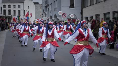 People-dancing-in-white-costumes-during-Aalst-carnival-parade