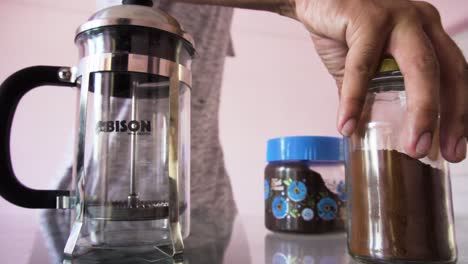 Young-Man-making-coffee-with-coffee-powder