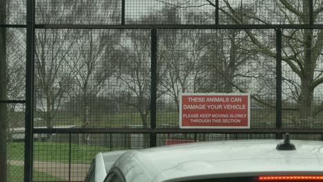 Warning-Sign-At-The-Entrance-Gate-To-The-Enclosure-In-Woburn-Safari-Park