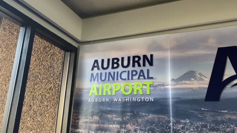 Auburn-Municipal-Airport-Sign-and-Logo-in-Interior-of-Building,-Washington-State-USA