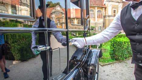 Close-up-of-a-man's-hand-closes-a-vintage-ford-model-t-car-door