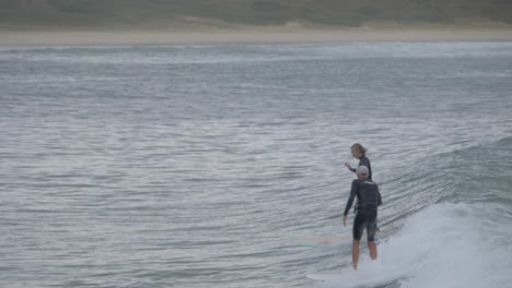 Surfers-Riding-Perfect-Ocean-Waves-In-Gold-Coast---Surfing-Spot-In-New-South-Wales,-Australia---slow-motion