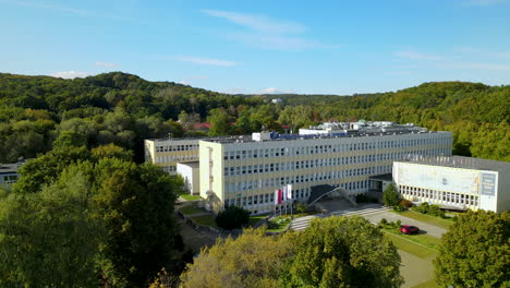 Faculty-Of-Economics-Building-At-The-University-Of-Gdansk-In-Poland---aerial-drone,-wide-shot