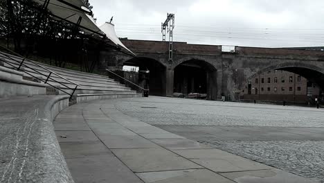 Timelapse-of-cyclist,-people---train-at-Manchester-outdoor-theatre