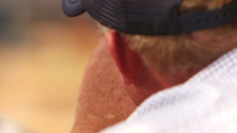 Closeup-of-an-anxious-man-looking-at-a-farm-land