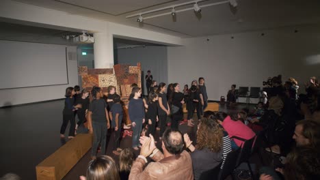 Parents-applauding-their-children-after-a-performance