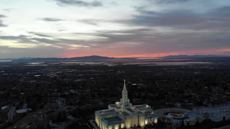 Drone-flies-toward-beautiful-LDS-temple-at-sunset