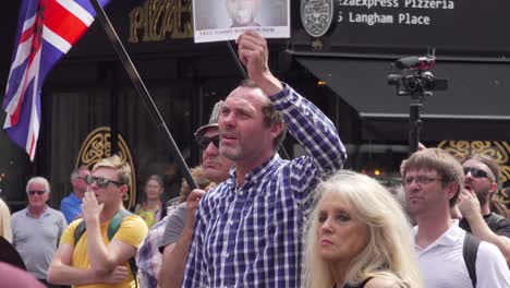 A-Tommy-Robinson-supporter-chants-outside-the-BBC-studio-in-London