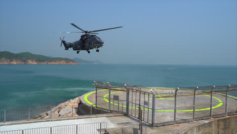 Hong-Kong-Government-Flying-Service-helicopter-approaching-and-landing-on-the-Cheung-Chau-Island-helipad