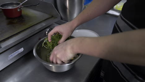 Chef-marinating-a-muttonbird-in-a-restaurant-kitchen