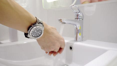 washing-hands-at-public-toilet