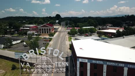 Aerial-Flyover-of-Bristol-Tennessee,-Virginia-Sign