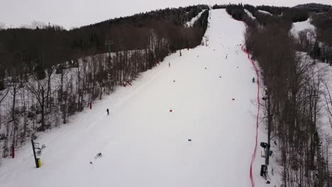 Aerial-footage-taken-from-a-drone-of-people-skiing-on-Burke-Mountain-in-Northern-Vermont