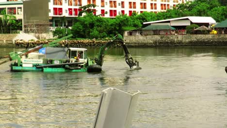 Dredgers-perform-cleaning-and-maintenance-work-on-the-Iloilo-River,-Western-Visayas,-Philippines
