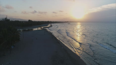 AERIAL:-Sunset-on-Honduran-beach---Tela,-Honduras-3