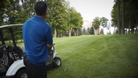 Golfer-taking-a-big-swing-on-the-driving-range-in-slow-motion