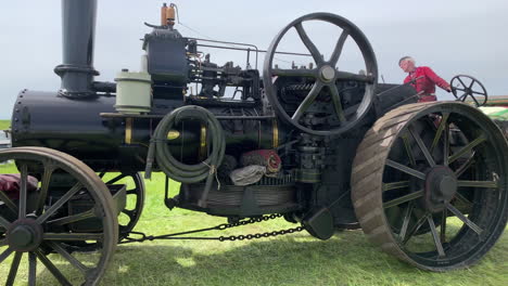 A-vintage-traction-engine-traveling-past-camera-at-a-Yorkshire-vintage-steam-fair