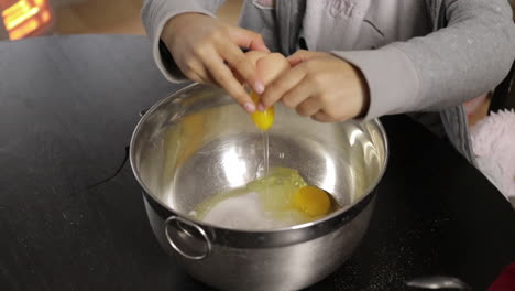 Children-making-a-cake-at-home,-soft-focus