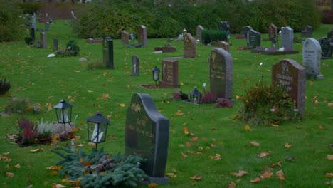 One-area-of-the-huge-Kviberg-Cemetery-in-Gothenburg,-Sweden---panning-shot