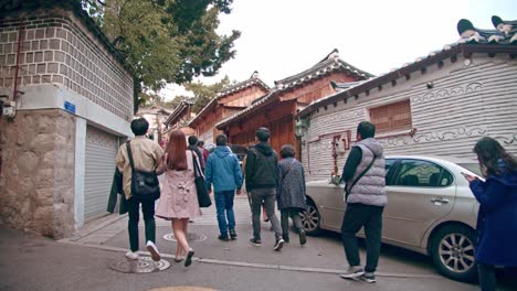 Tourists-walking-and-taking-photo-at-Bukchon-Hanoak-village-in-seoul-tourists-travelling-in-Korean-traditional-village