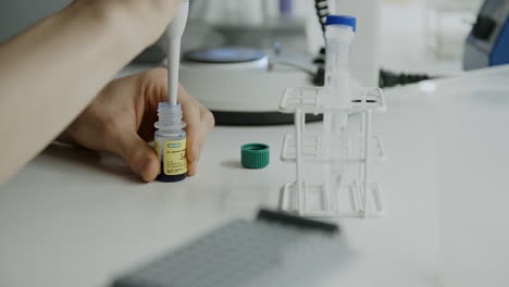 Slow-motion-close-up-orbiting-shot-of-lab-work-with-test-tubes