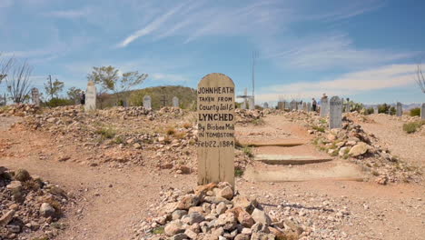 An-old-gravestone-from-the-old-times-standing-in-the-Boothill-cemetery-in-Tombstone,-Arizona---wide-shot