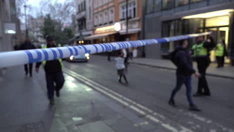 Police-officers-escort-members-of-the-public-outside-a-police-cordon-during-the-discovery-of-a-World-War-Two-bomb-on-Dean-Street-in-London’s-Soho